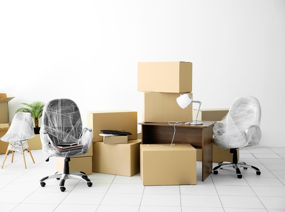 office items packed and wrapped Office Moving Checklist + Corporate Relocation Guide