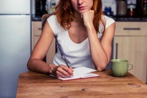 woman making list 300x200 10 Ways to Calm Your Moving Anxiety