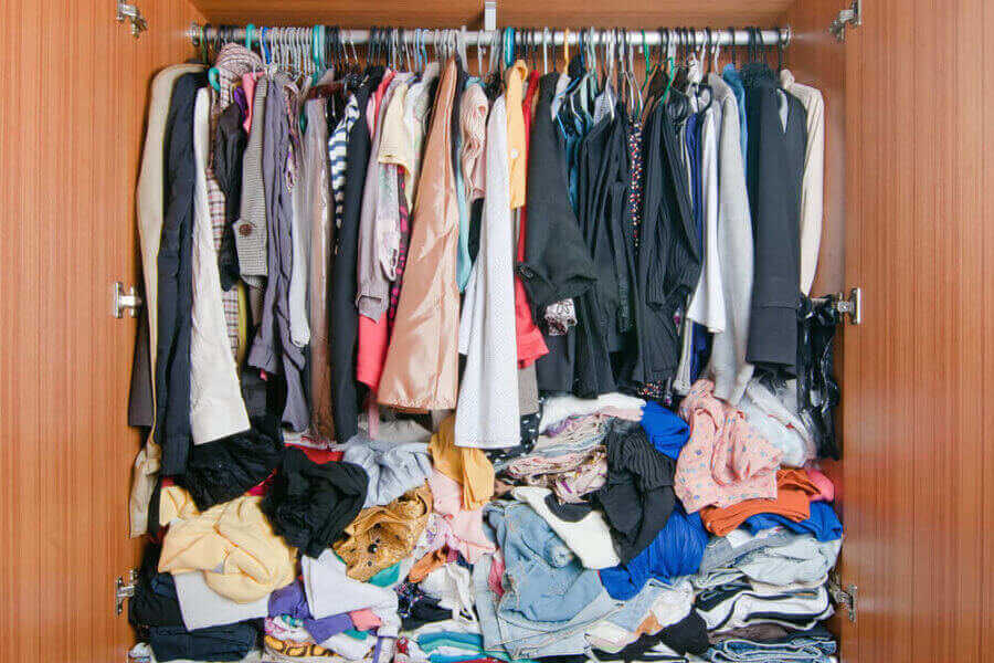 closet stuffed full of clothes e Smart Ways to Cut Moving Costs