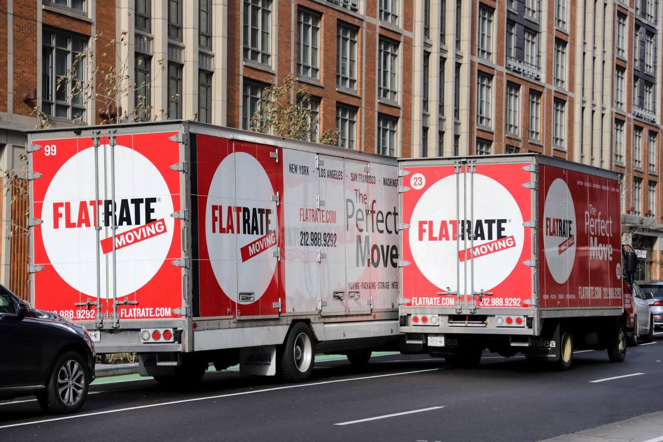 Flatrate Elite mover transporting disassembled boxes