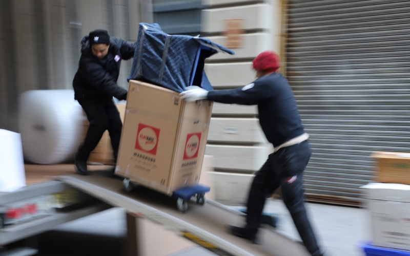 Movers loading a truck that is ready for the move