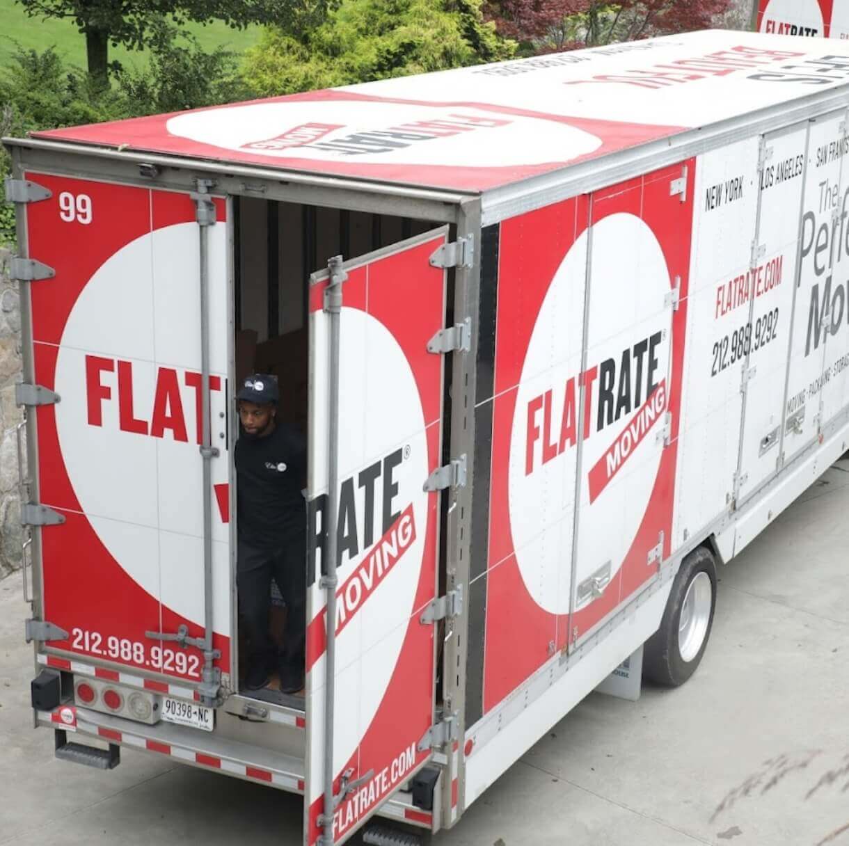 Flatrate moving truck parked with the back door open, ready for loading or unloading