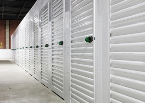 Hallway with white storage doors